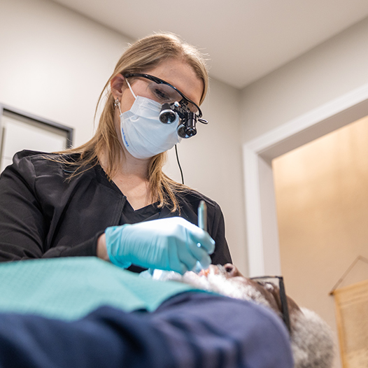 Patient looking at smile after dental treatment