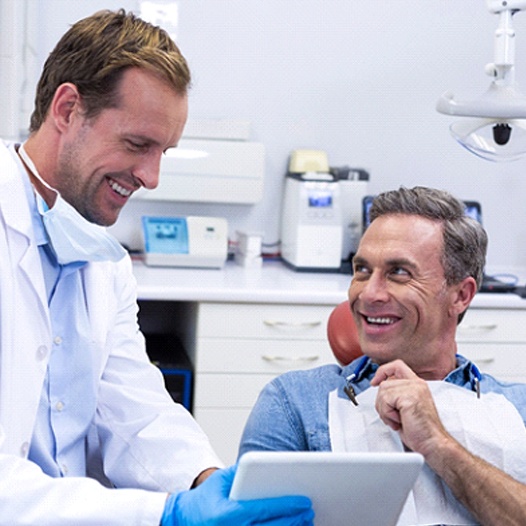 Man at dentist for dental crown in Pensacola