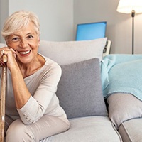 a woman smiling with new dentures