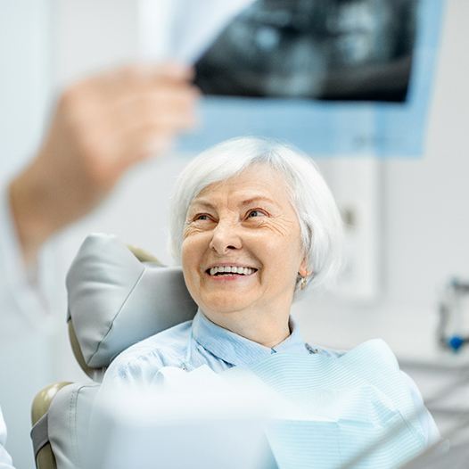 patient talking to dentist about dentures in Pensacola 