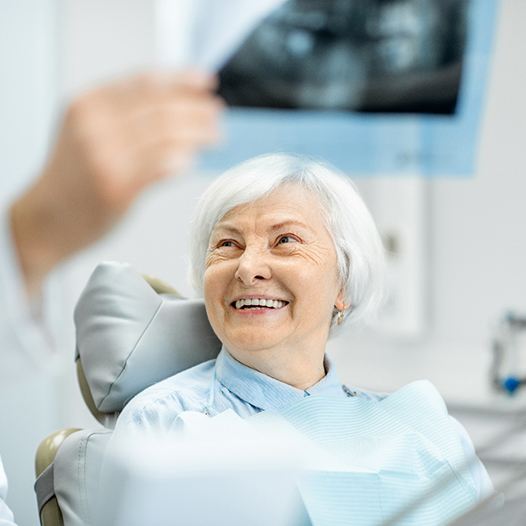 patient talking to dentist about dentures in Pensacola