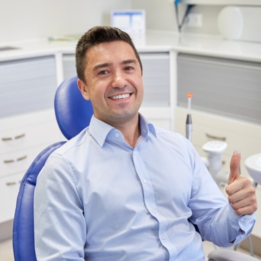 Man giving thumbs up after  emergency dentistry