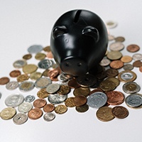 Piggy bank and loose coins