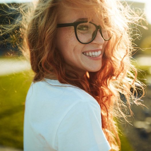 happy woman after enjoying the benefits of KöR teeth whitening in Pensacola
	