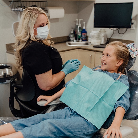 Child smiling after children's dentistry visit