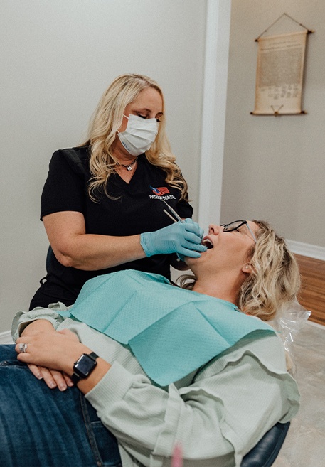 Woman smiling after preventive dentistry