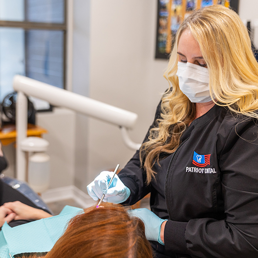 Child receiving dental checkup and teeth cleaning