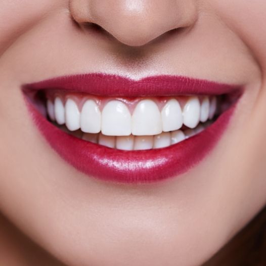 Man and woman brushing teeth after periodontal therapy