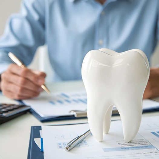 Man budgeting for the cost of dental care