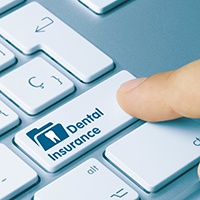 Patient in Pensacola checking dental insurance for root canal coverage