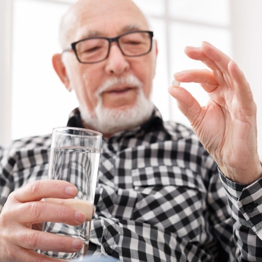 Man taking oral conscious dental sedation pill