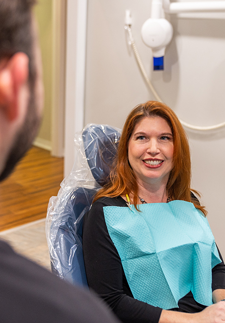 Mother and child smiling after receiving dental services