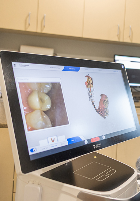 Man smiling after visiting his dentist in Pensacola Florida