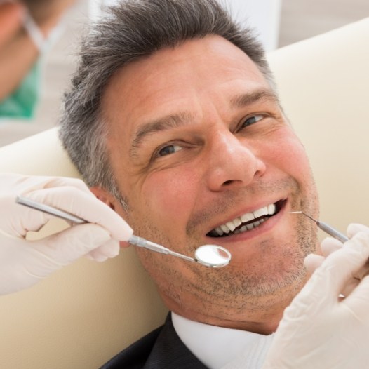 Man smiling before intraoral photographs are captured
