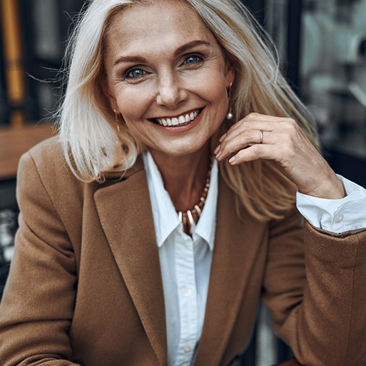 Woman smiling with veneers in Pensacola