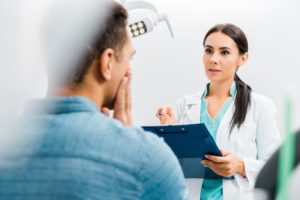 patient talking to dentist  