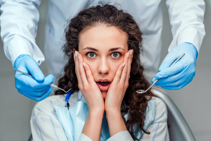 A scared woman who’s about to receive dental care