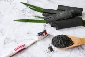 Activated charcoal toothpaste on a toothbrush
